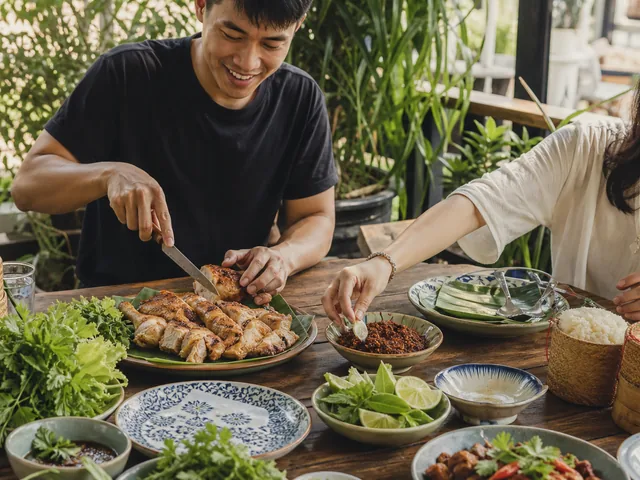 Friends serving Chiang Mai grilled chicken with crispy chili dip
